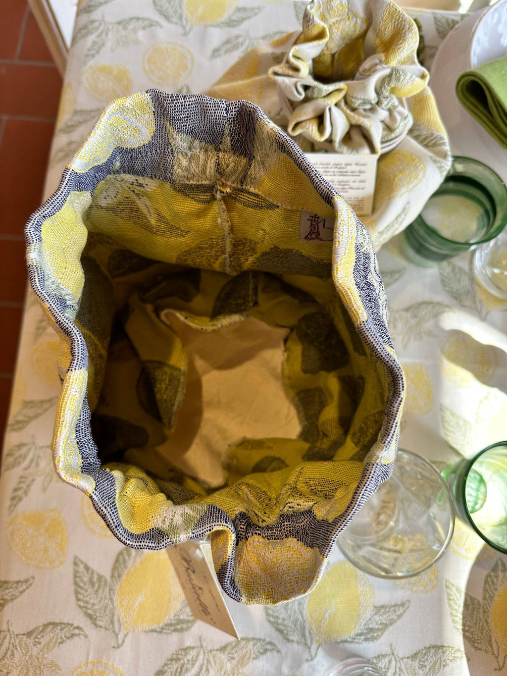 Fabric bag with floral pattern on a tablecloth with floral design
