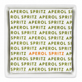 Square white plate with 'Aperol Spritz' text pattern on a white background