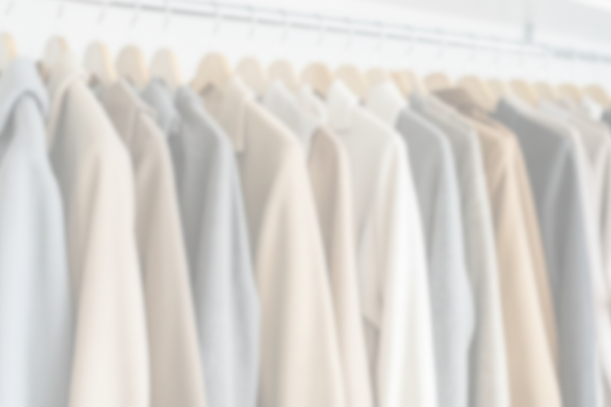 Blurred neutral clothing rack 15% opacity
